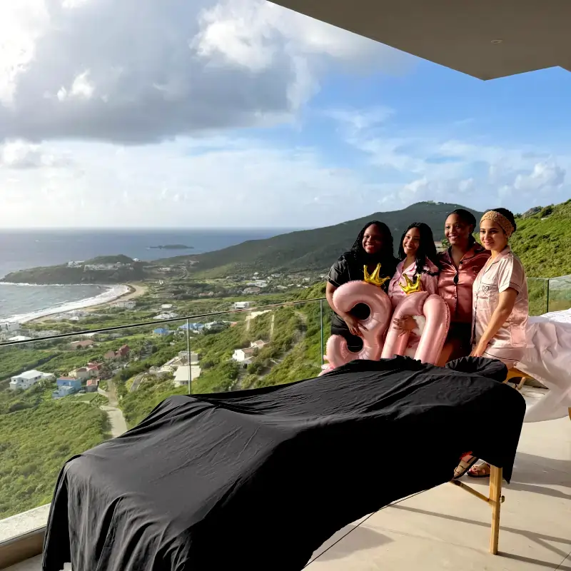 sxm-birthday-celebration Women celebrating 30th birthday poolside with massage setup