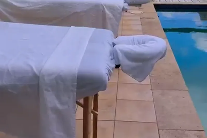 Massage tables set up poolside with an ocean view, representing SXM Mobile Massage's in-villa wellness setup
